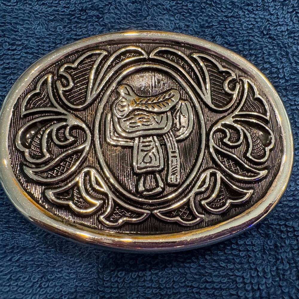 Silver Western Belt Buckle with intricate saddle design